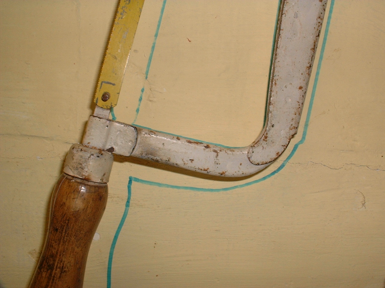 Old tools on personal workshop wall 2.jpg — illustrating How Should a Small Garage Workshop Actually Be Laid Out?